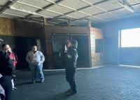 Students touring inside the barn at Spy Coast Farm in Kentucky.